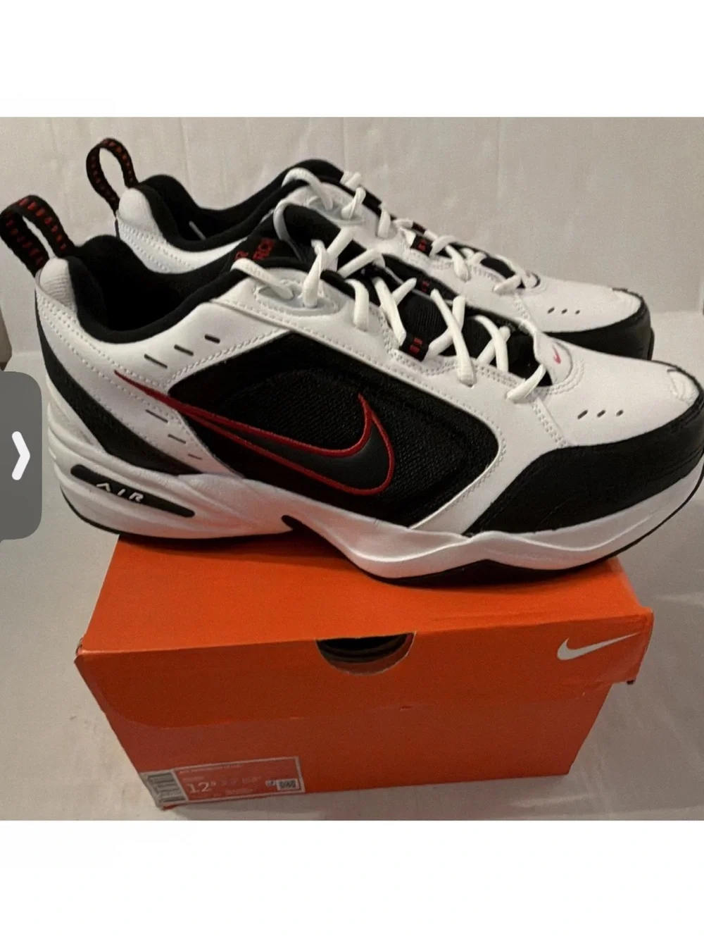 Nike Air Monarch IVMen’s White & Black Athletic Sneakers with Red Accents